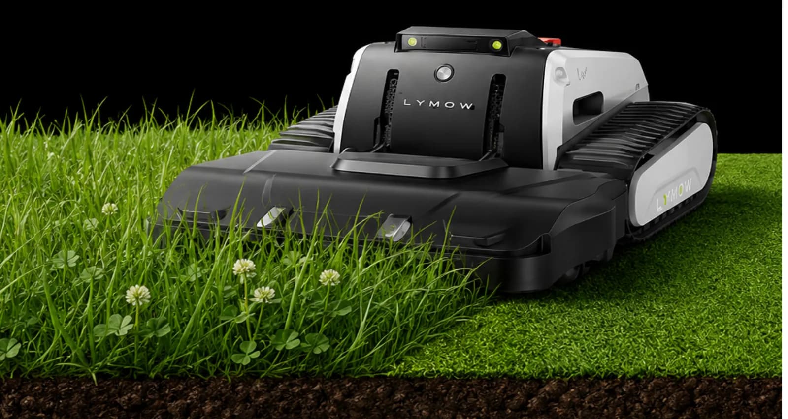 Lymow One Plus moving from taller grass into a freshly cut lawn