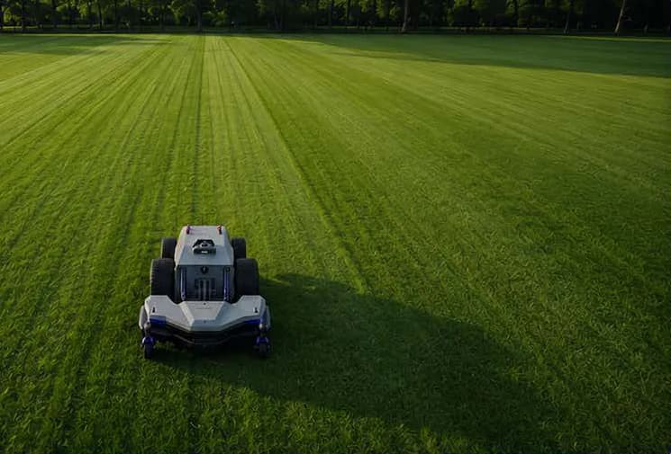 Pandag G1 following a mowing route across a large commercial property