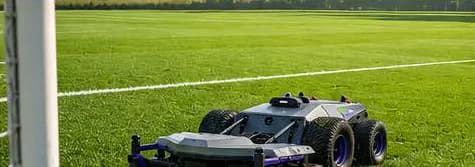 Pandag G1 mowing a marked commercial sports field