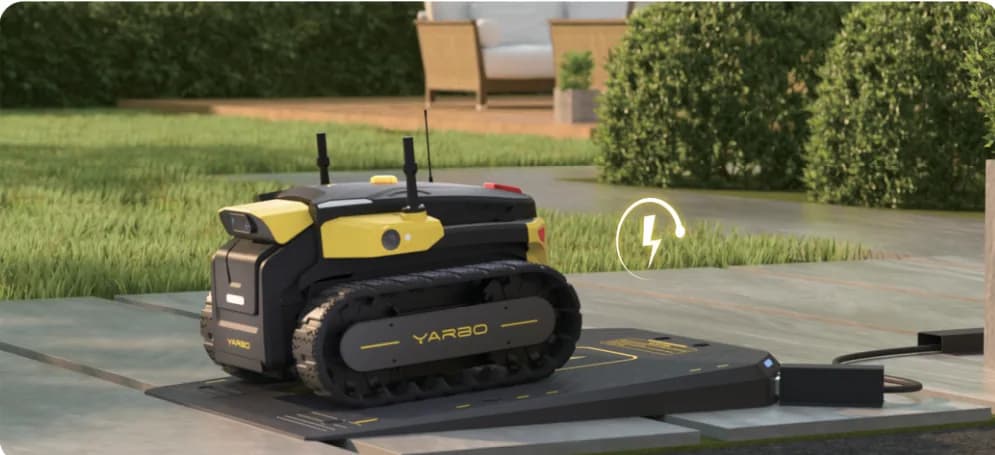 Yarbo Core parked on its charging dock.
